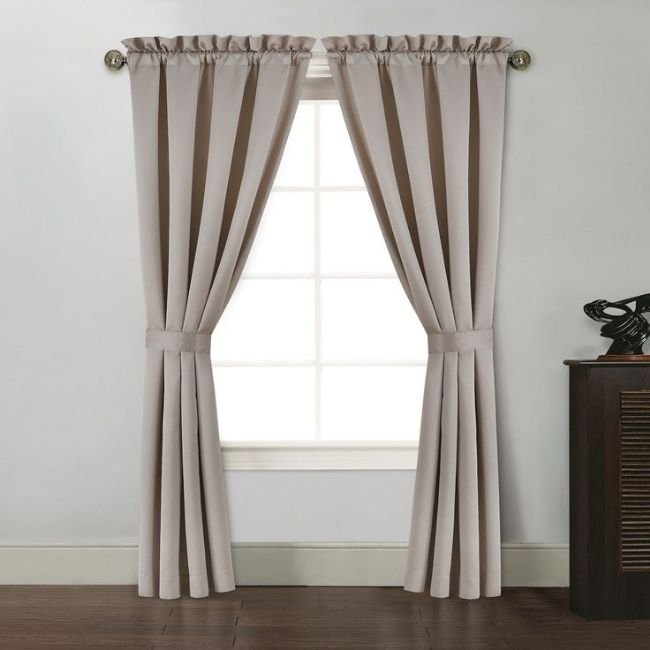 Decorative curtain tie-back installed in bedroom
