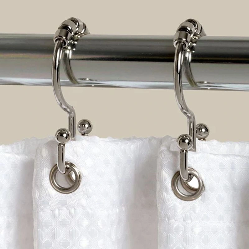 Metal hooks supporting heavy curtain fabric